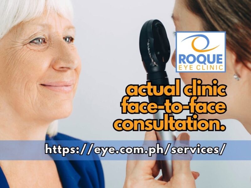 This image shows an eye doctor holding an ophthalmoscope while doing direct funduscopy in a face-to-face consultation in clinic.