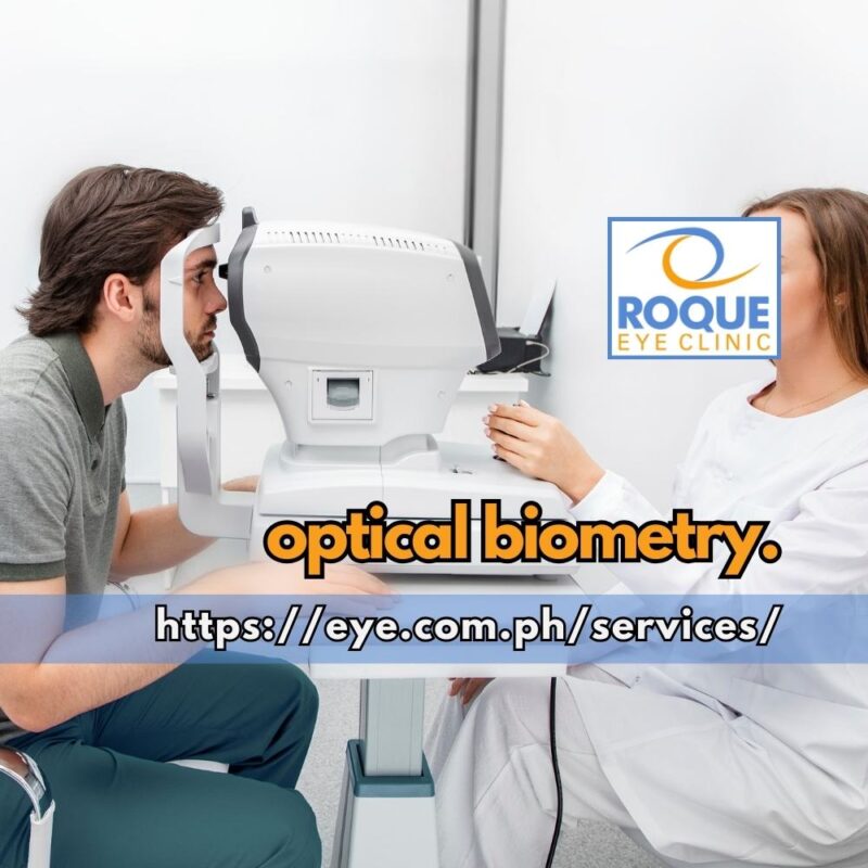 This image shows a technician performing optical biometry on a seated patient.